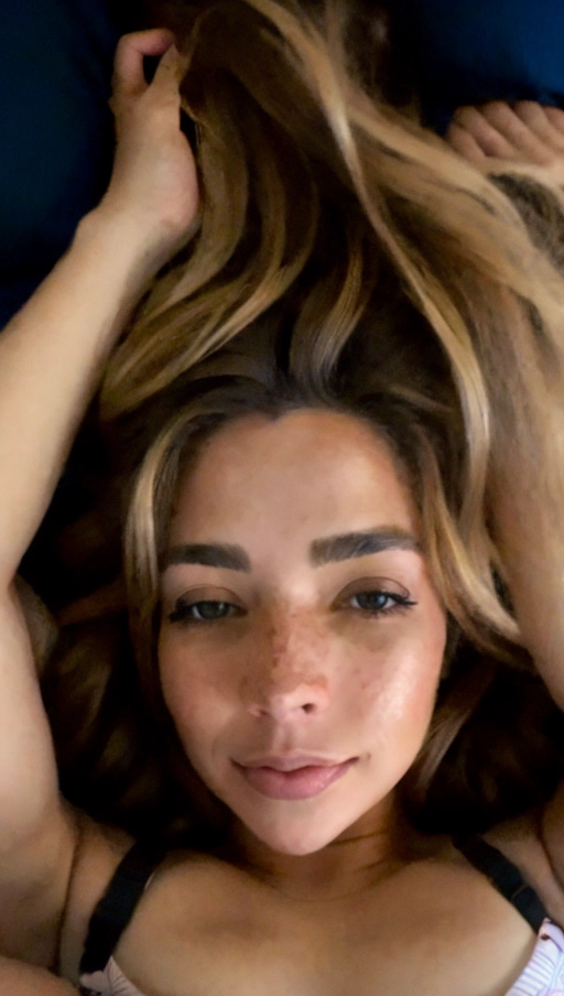 <lora:JlgblwOYz8w_Alyssa:1>, (((pretty with dark blonde hair with light skin laying on a blue bed))), (((photo of Alyssa Barrantes))), (((light brown eyes))), (((small light freckles))), (((only one head))), (((full body visible)))